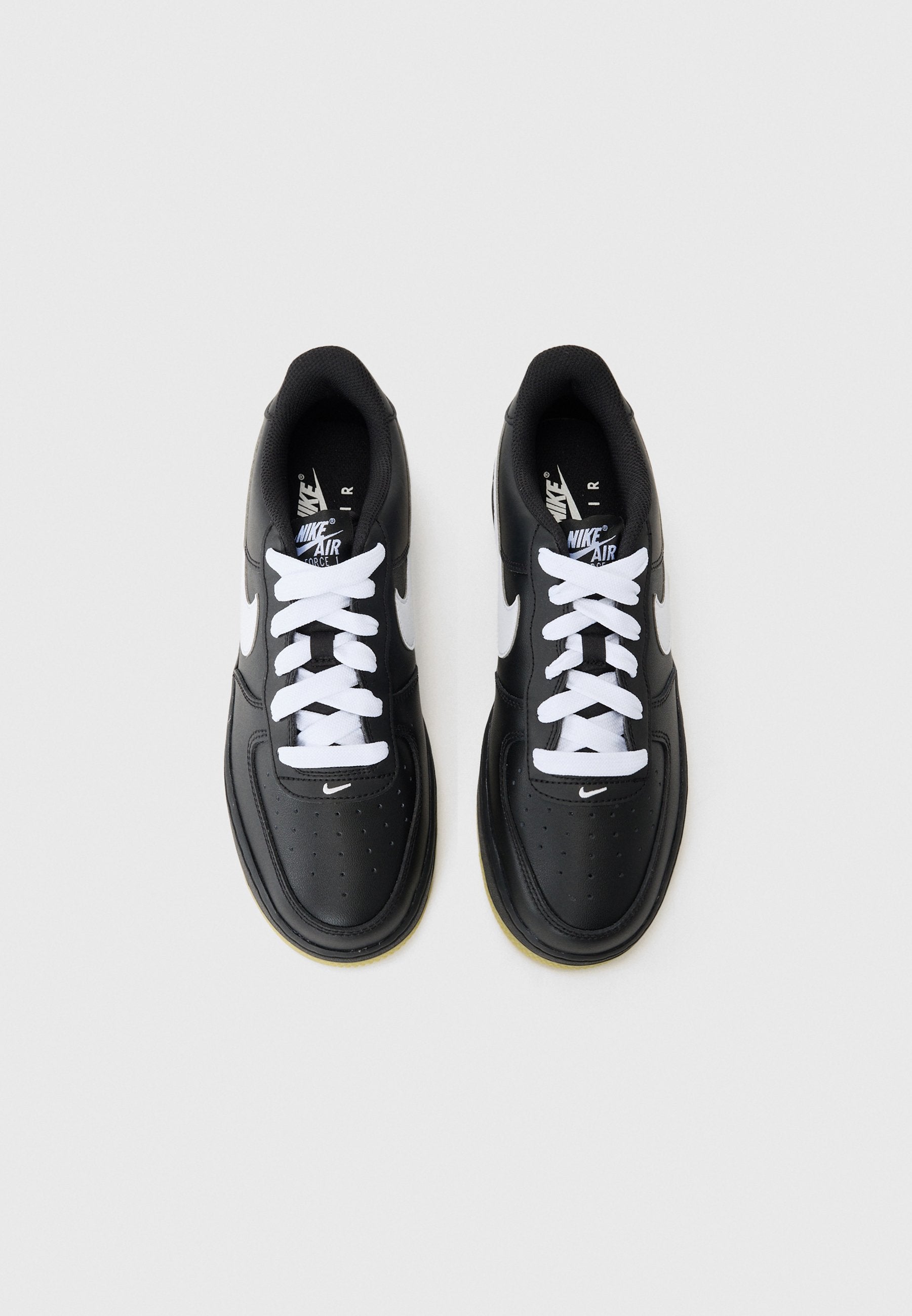 Classic Nike Air Force 1 Unisex Trainers: Iconic Black and White Styling